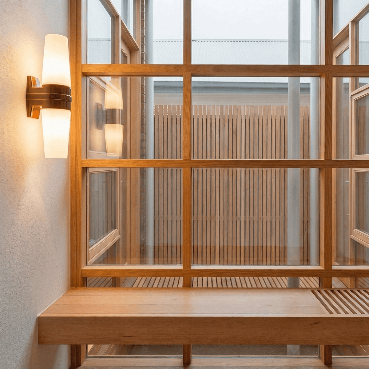 Brown glazed porcelain double wall light with cast glass