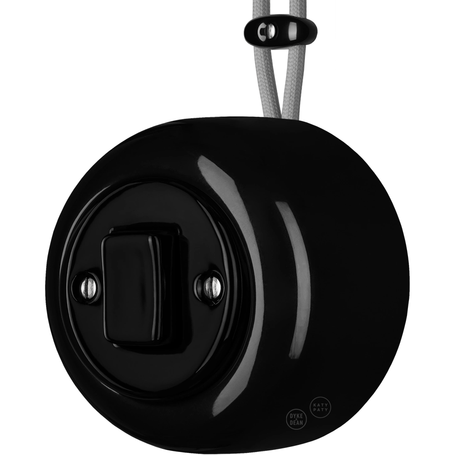 Black round porcelain surface-mounted fat button light switch by Katy Paty