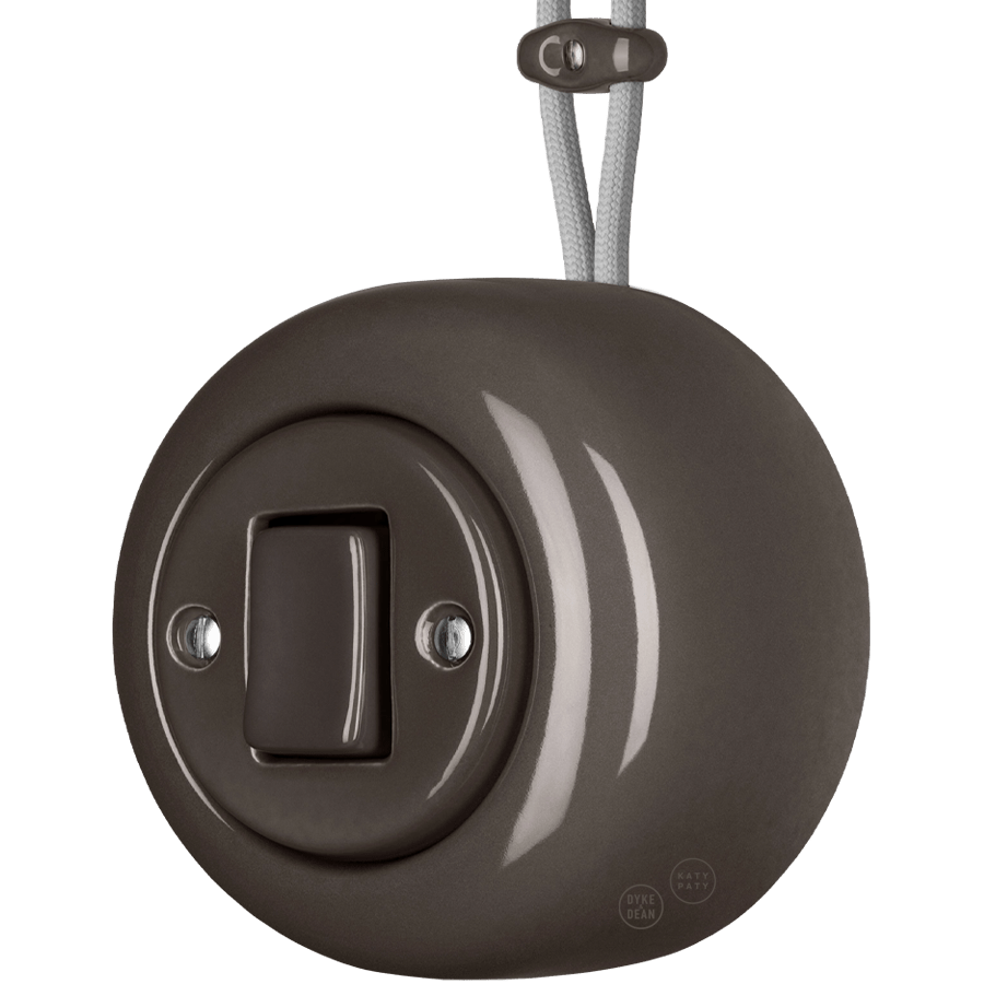 Brown round porcelain surface-mounted fat button light switch by Katy Paty