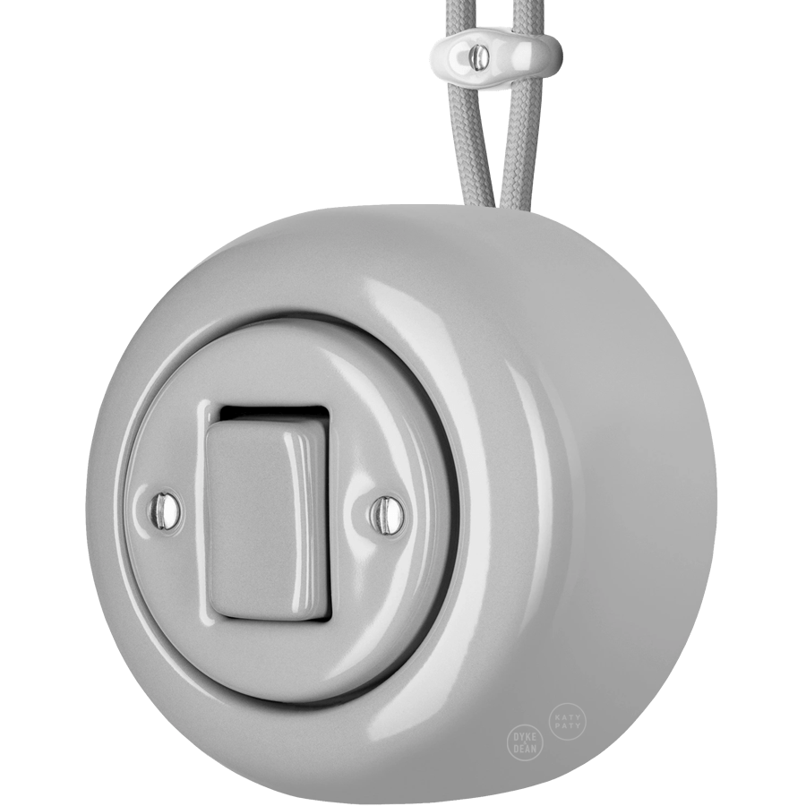 Grey round porcelain surface-mounted fat button light switch by Katy Paty