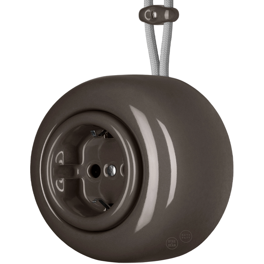 Brown round porcelain surface-mounted schuko socket by Katy Paty
