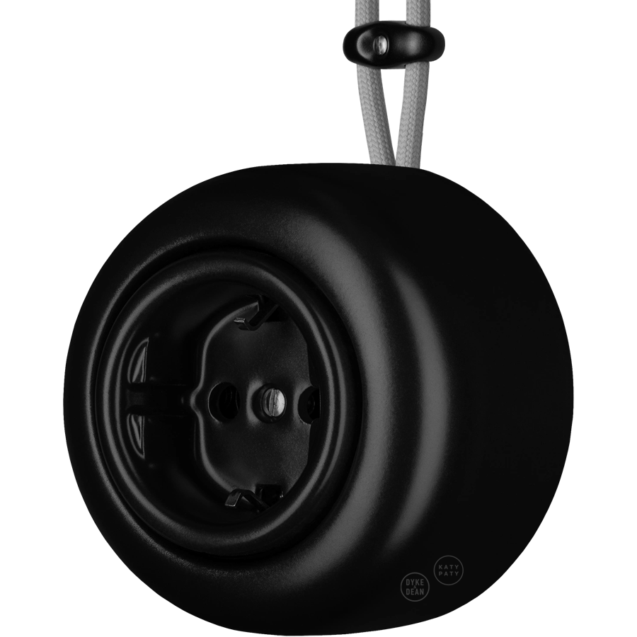 Matt Black round porcelain surface-mounted schuko socket by Katy Paty