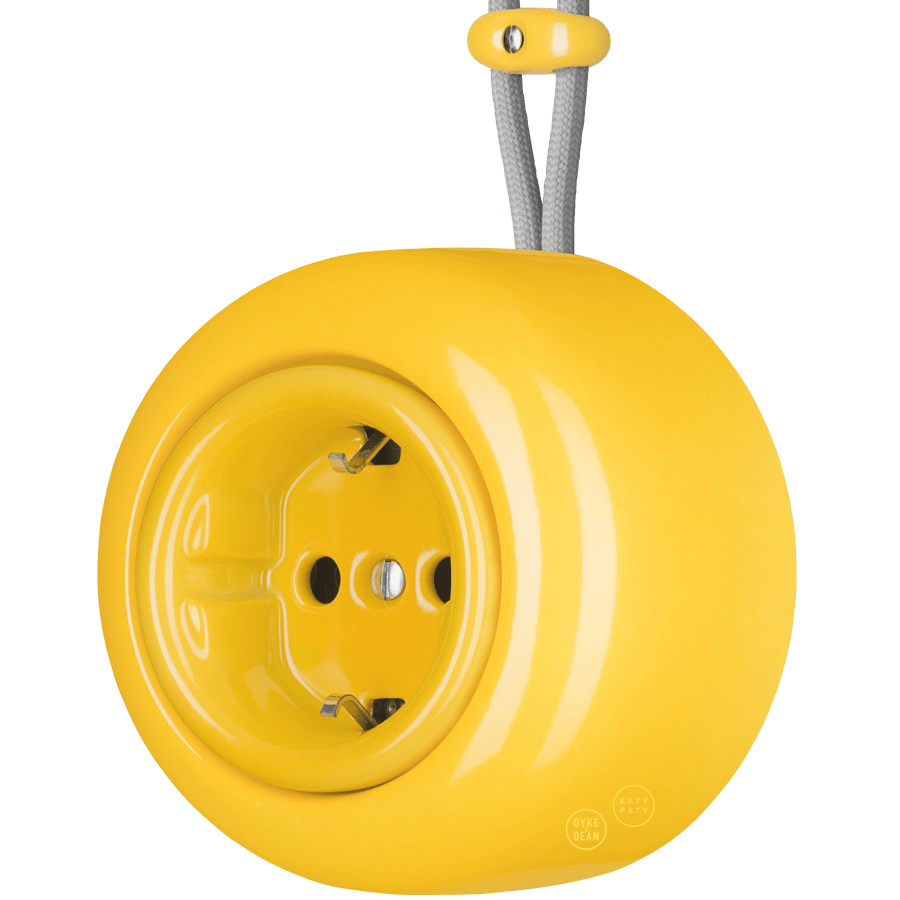 Yellow round porcelain surface-mounted schuko socket by Katy Paty