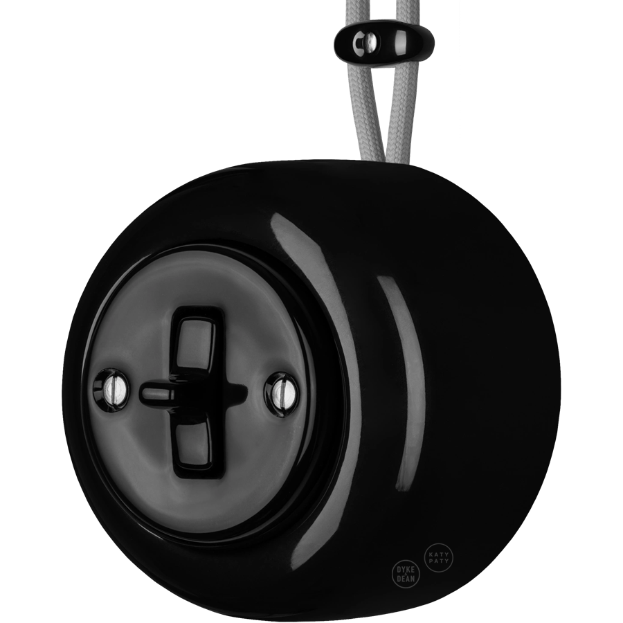 Black round porcelain surface-mounted toggle switch by Katy Paty