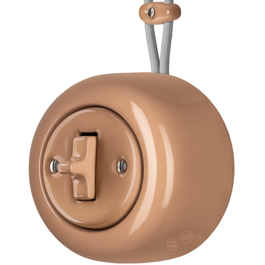 Derma round porcelain surface-mounted toggle switch by Katy Paty