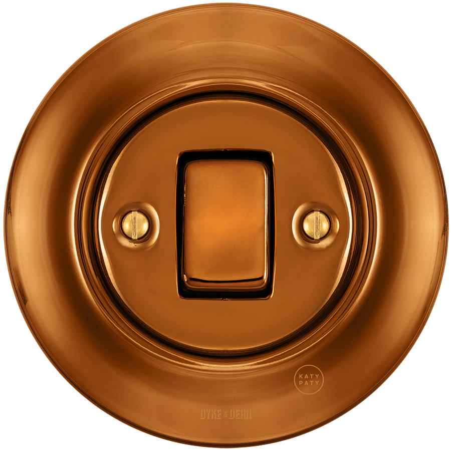 Bronze porcelain wall light switch with fat button by Katy Paty