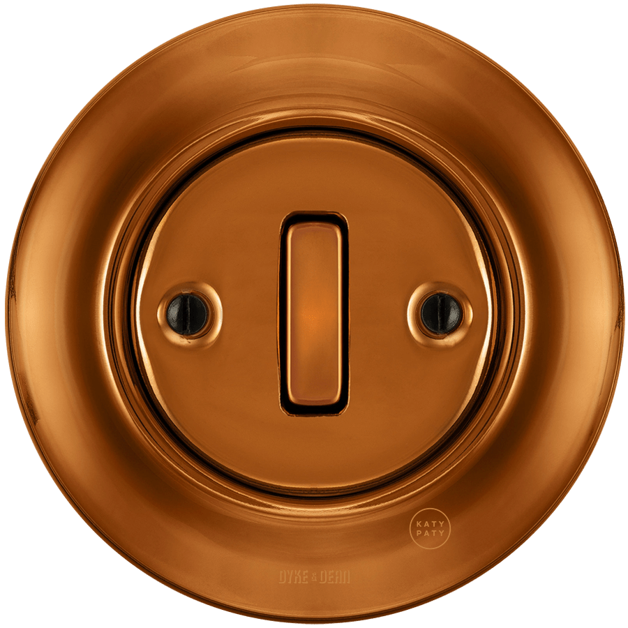 Bronze porcelain wall light switch with slim button by Katy Paty