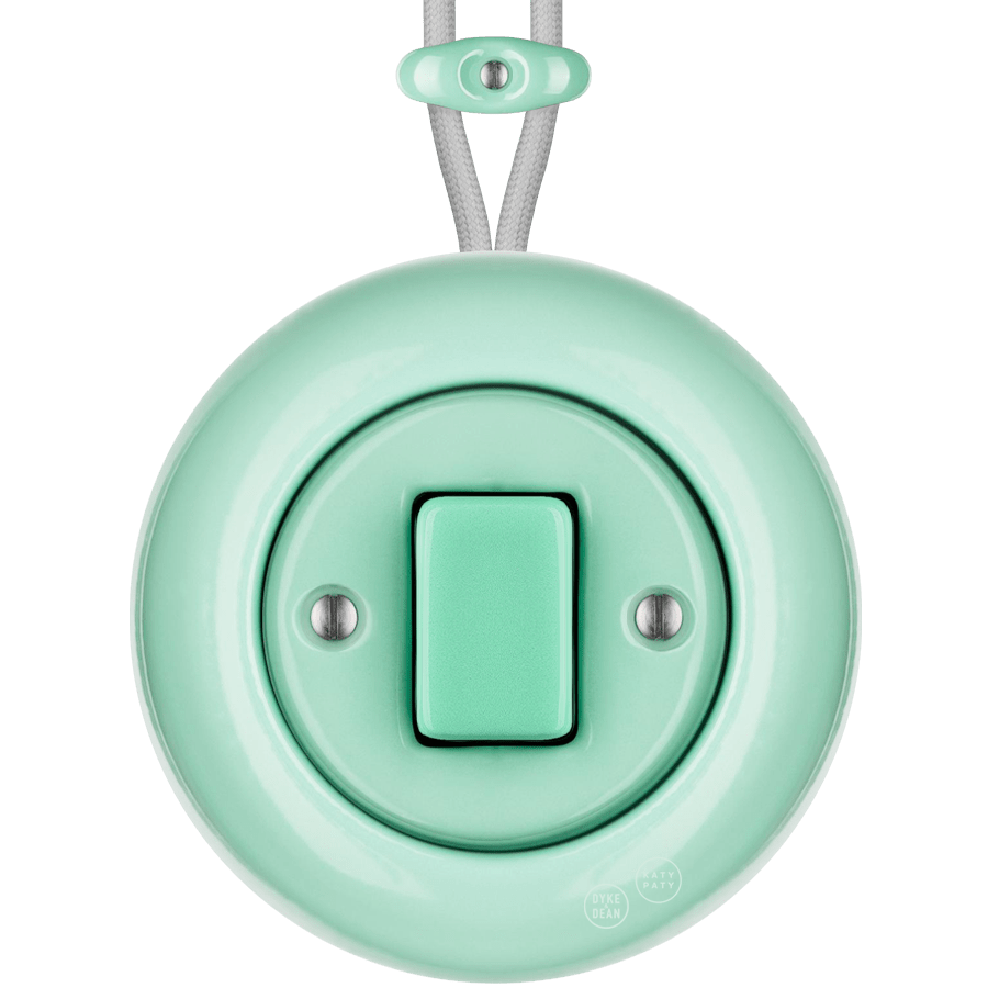 Mint round porcelain surface-mounted fat button light switch by Katy Paty