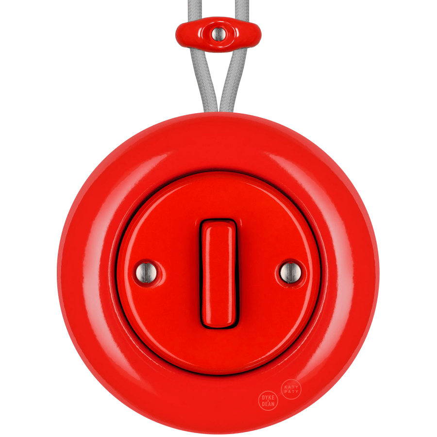 Red round porcelain surface-mounted slim button switch by Katy Paty
