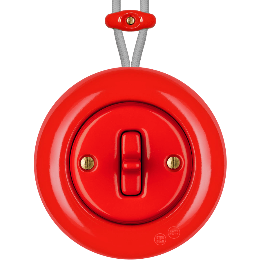 Red round porcelain surface-mounted toggle switch by Katy Paty