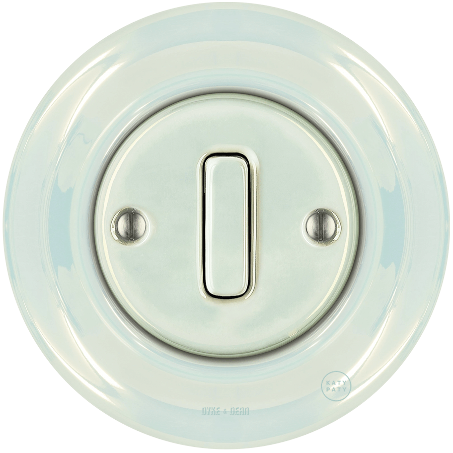 Concha porcelain wall light switch with slim button by Katy Paty