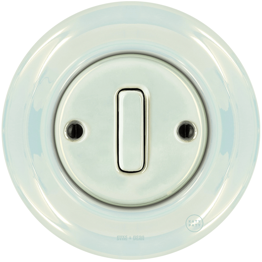 Concha porcelain wall light switch with slim button by Katy Paty