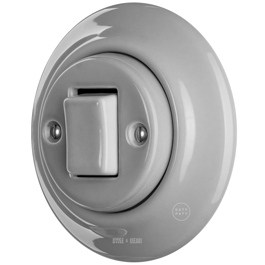 Grey porcelain wall light switch with fat button by Katy Paty