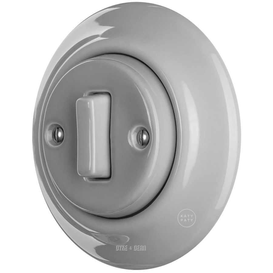 Grey porcelain wall light switch with slim button by Katy Paty